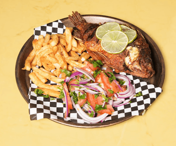 Fried tilapia with chips and kachumbari